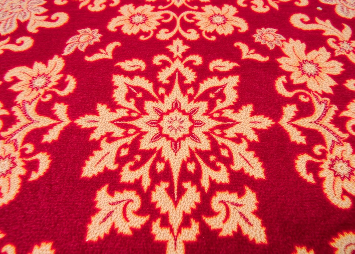 Close-up detail of a traditional Persian Tabriz rug with floral medallion pattern